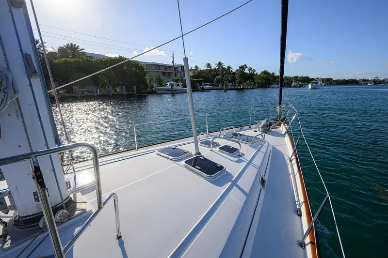 Slide: The Image of Deck view of 2003 Beneteau 50 sailboat on calm waters, sunny day. - 34