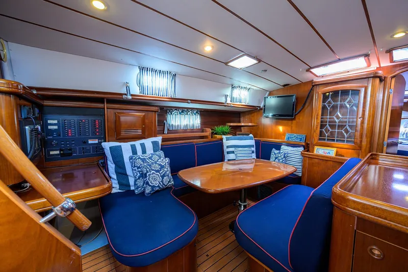 Slide: The Image of Luxurious interior of 2003 Beneteau 50 yacht with elegant wood finish and cozy seating. - 38