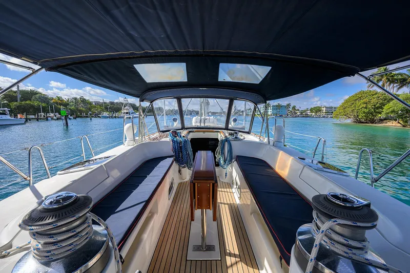 Slide: The Image of Cockpit view of 2003 Beneteau 50 sailboat with scenic marina backdrop. - 4