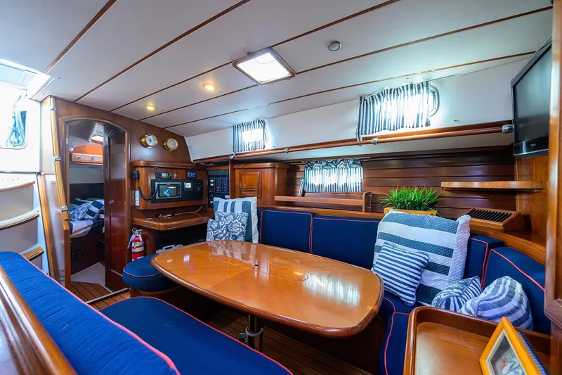 Slide: The Image of Luxurious interior of 2003 Beneteau 50 yacht with cozy seating and elegant wood finish. - 40
