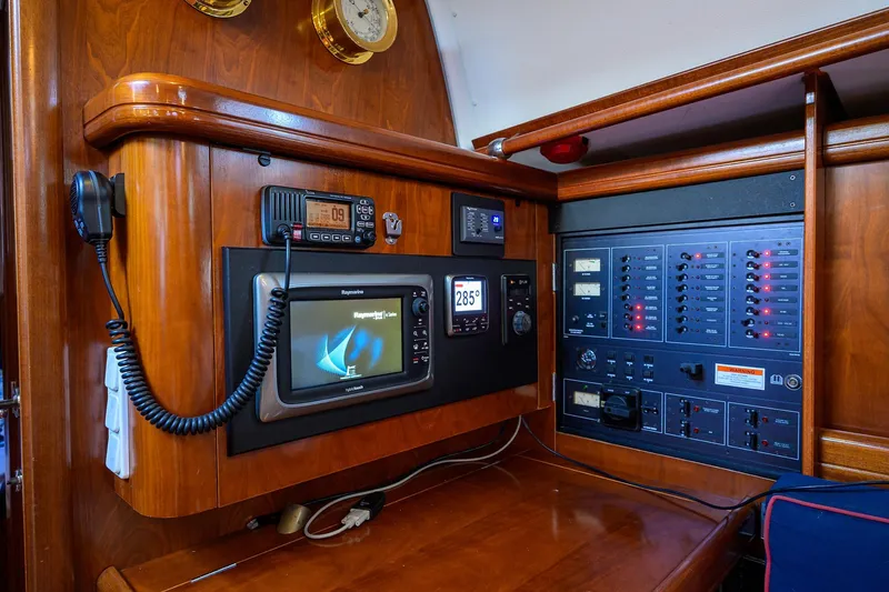 Slide: The Image of Navigation and control panel of a 2003 Beneteau 50 yacht, featuring advanced electronics. - 45