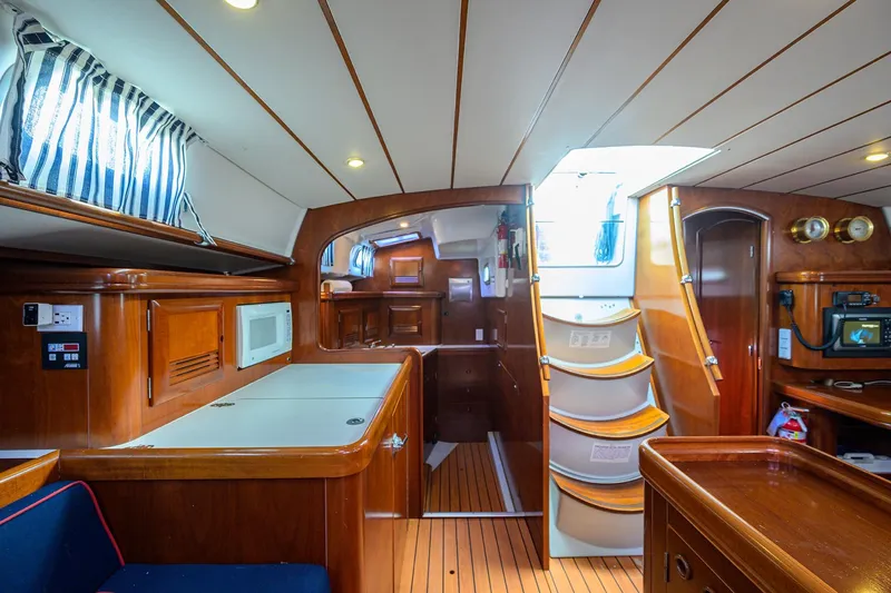 Slide: The Image of Interior of 2003 Beneteau 50 yacht with wooden finish and modern amenities. - 48