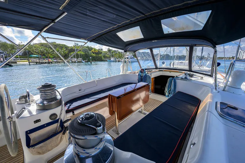 Slide: The Image of Cockpit view of 2003 Beneteau 50 sailboat with seating and winches, dockside. - 5