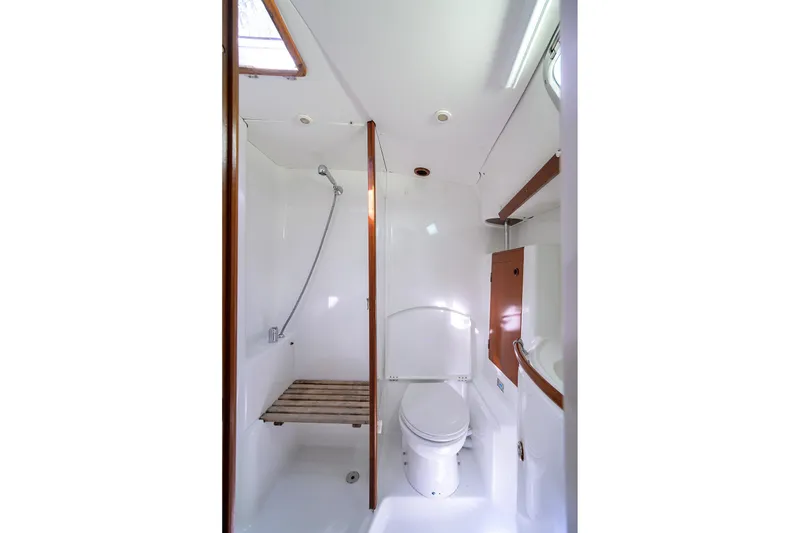 Slide: The Image of Bathroom interior of 2003 Beneteau 50 yacht, featuring shower and toilet. - 57