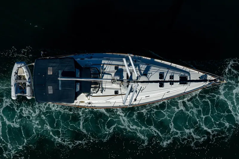 Slide: The Image of Aerial view of 2003 Beneteau 50 yacht sailing on ocean waves. - 85