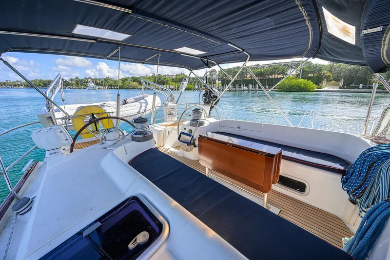 Slide: The Image of Spacious cockpit of 2003 Beneteau 50 yacht with scenic waterfront view. - 9