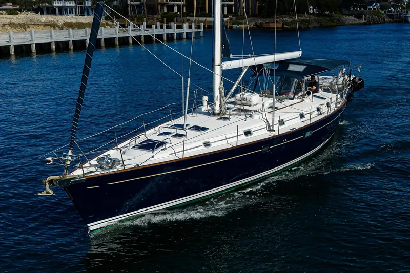 Slide: The Image of Sailing yacht Beneteau 50, 2003 model, cruising on calm blue waters. - 93