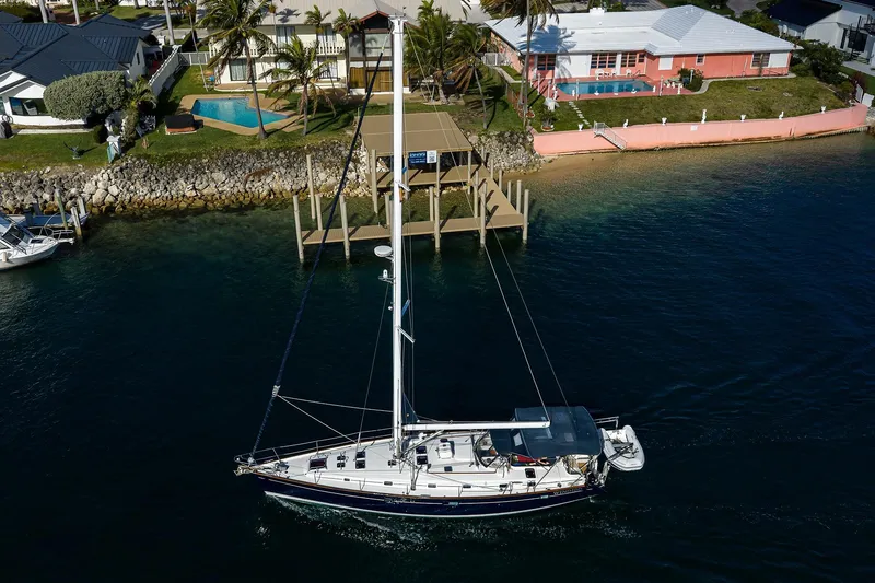 Slide: The Image of Aerial view of 2003 Beneteau 50 sailboat near waterfront homes. - 95