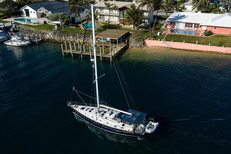 Slide: The Image of Aerial view of 2003 Beneteau 50 sailboat near waterfront homes. - 97