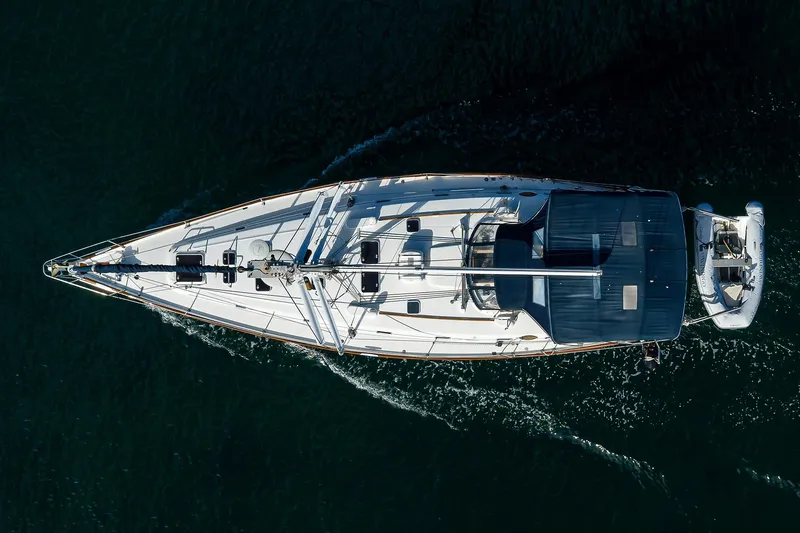 Slide: The Image of Aerial view of 2003 Beneteau 50 yacht sailing on dark water. - 99
