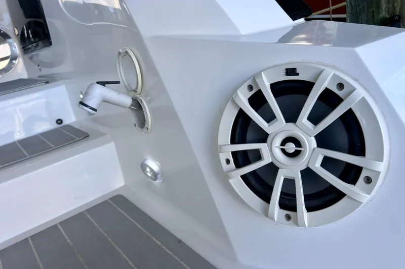 Slide: The Image of 2024 NX Boats 370 HT featuring JBL speaker and water outlet on deck. - 20