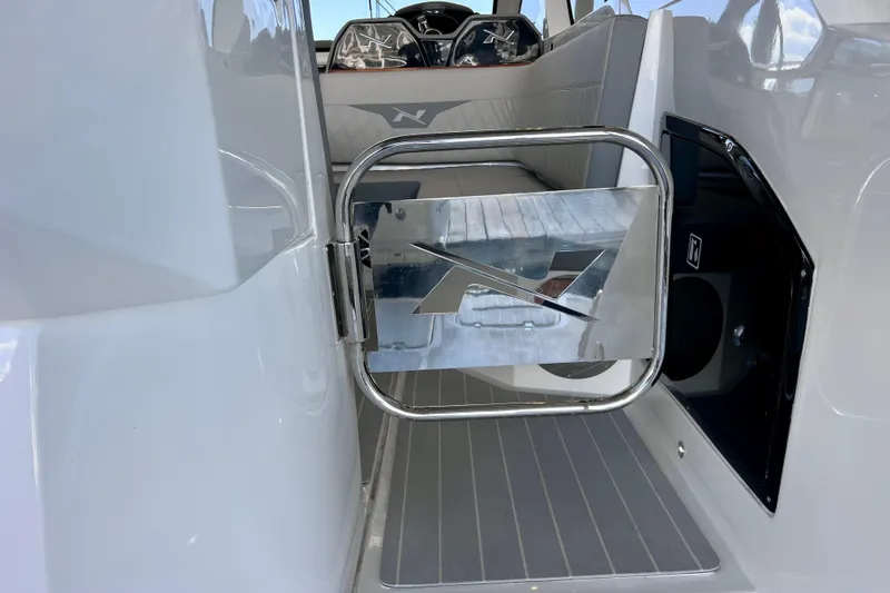 Slide: The Image of 2024 NX Boats 370 HT interior with sleek design and modern features. - 21