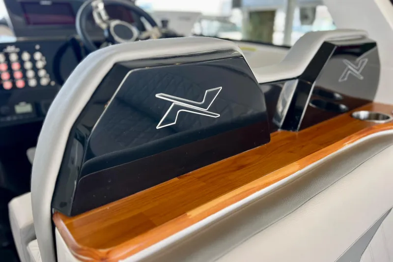 Slide: The Image of 2024 NX Boats 370 HT interior with sleek design and modern dashboard features. - 30