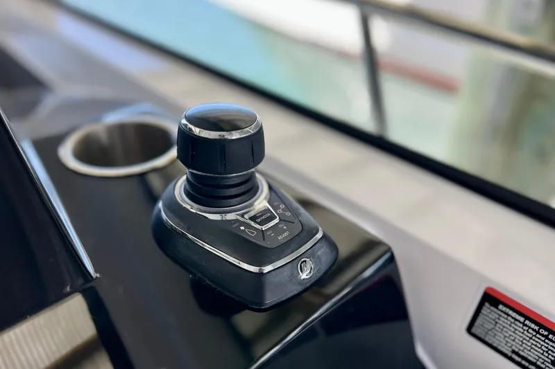 Slide: The Image of Joystick control on 2024 NX Boats 370 HT dashboard, featuring sleek design and functionality. - 38