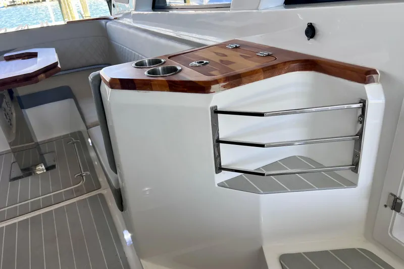 Slide: The Image of 2024 NX Boats 370 HT interior with sleek wood accents and modern design elements. - 46