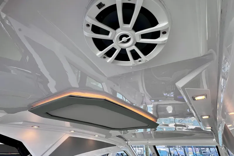 Slide: The Image of 2024 NX Boats 370 HT interior ceiling with speaker and ambient lighting. - 51