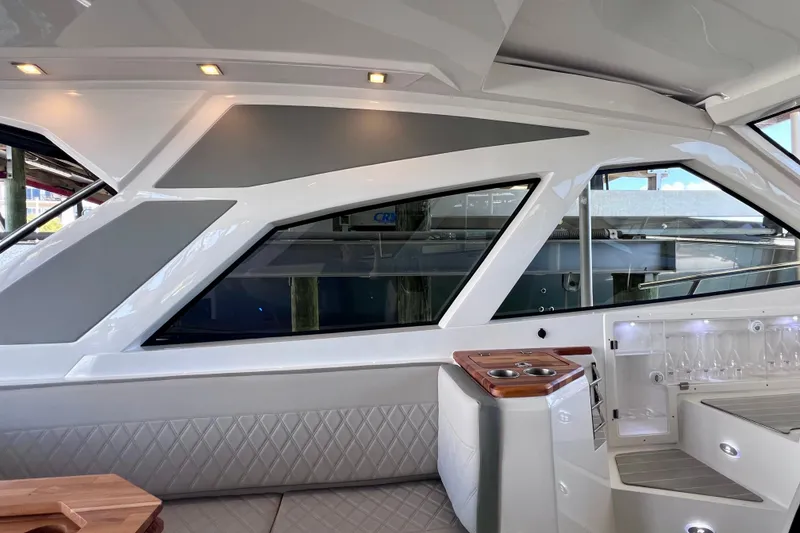 Slide: The Image of Interior of 2024 NX Boats 370 HT, featuring modern design and luxurious seating. - 52