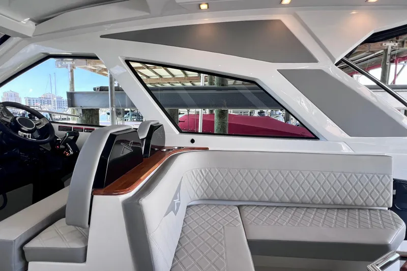 Slide: The Image of 2024 NX Boats 370 HT interior with modern design and luxurious seating. - 53