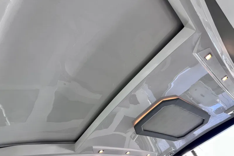 Slide: The Image of Interior ceiling of 2024 NX Boats 370 HT with modern lighting and sleek design. - 54