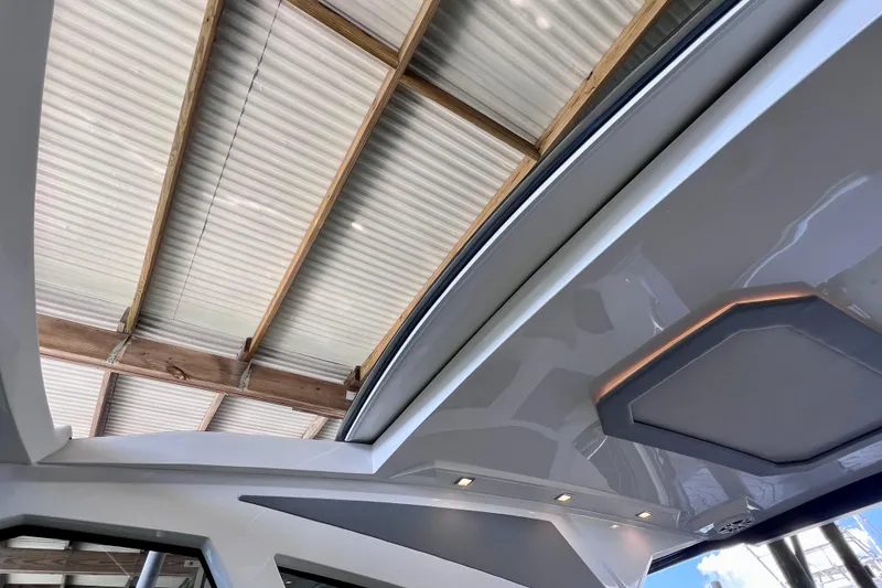 Slide: The Image of 2024 NX Boats 370 HT interior roof detail with modern lighting and sleek design. - 55