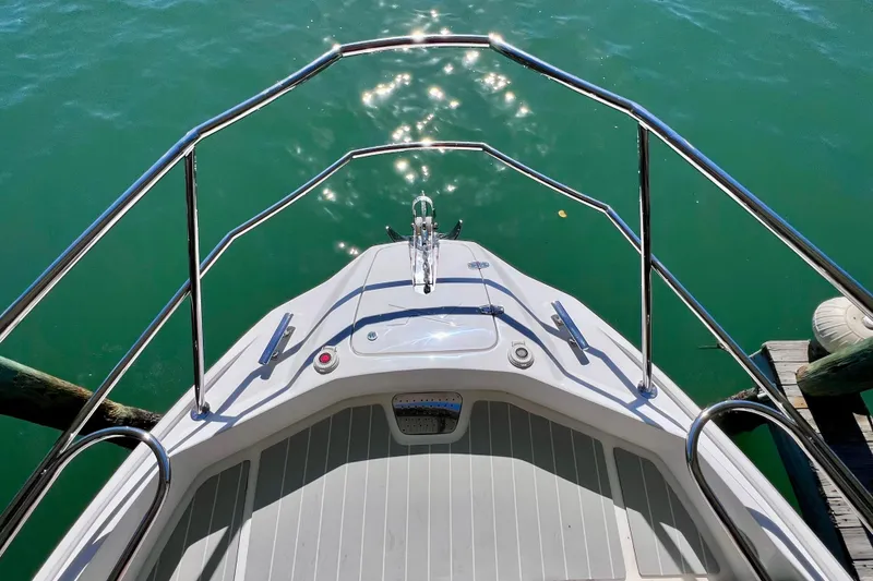 Slide: The Image of Bow view of 2024 NX Boats 370 HT on calm water. - 59