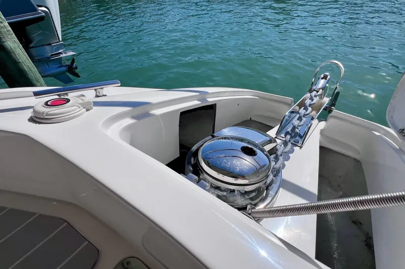 Slide: The Image of 2024 NX Boats 370 HT anchor system on clear blue water. - 60
