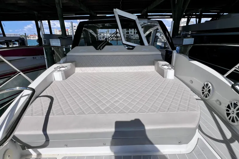 Slide: The Image of 2024 NX Boats 370 HT with spacious deck seating and modern design. - 61