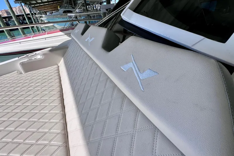 Slide: The Image of 2024 NX Boats 370 HT with luxurious quilted seating and embroidered logo. - 63
