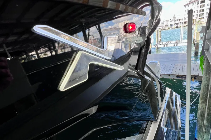 Slide: The Image of 2024 NX Boats 370 HT docked, showcasing sleek design and modern features. - 65