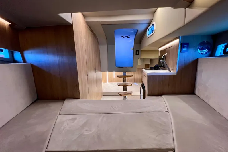 Slide: The Image of Luxurious interior of 2024 NX Boats 370 HT with modern design and ambient lighting. - 79