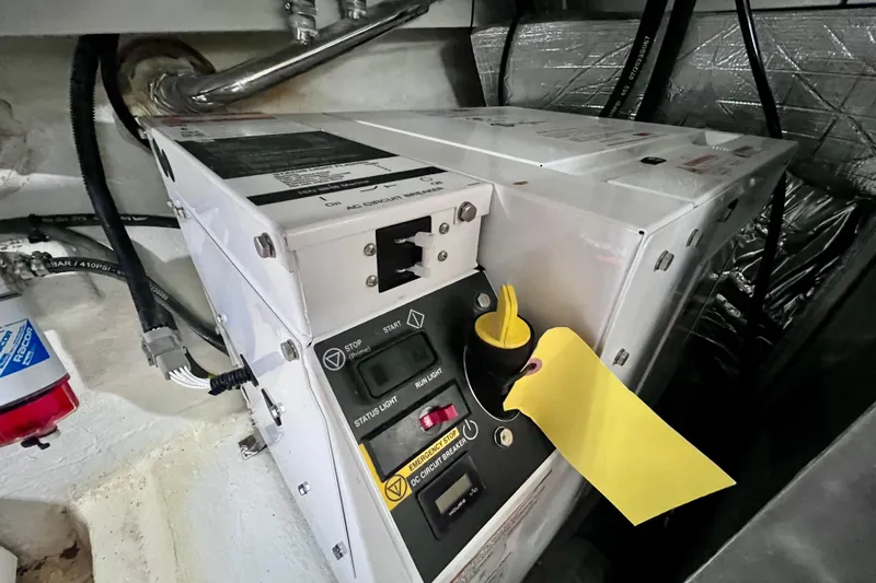 Slide: The Image of Electrical panel in 2024 NX Boats 370 HT engine room, featuring control switches and wiring. - 85