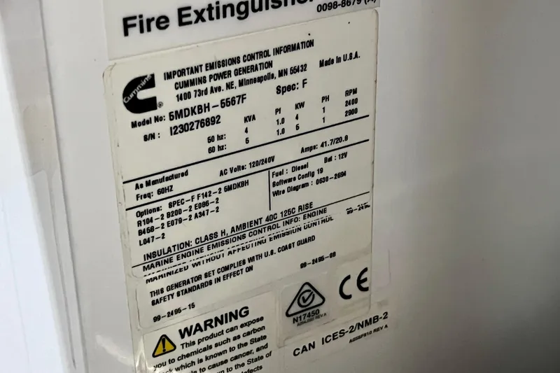 Slide: The Image of Label on Cummins power generator, model 6MDKBH-5667F, for NX Boats 370 HT 2024. - 86