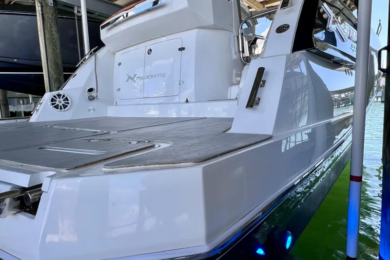 Slide: The Image of 2024 NX Boats 370 HT yacht with sleek design and spacious deck. - 9
