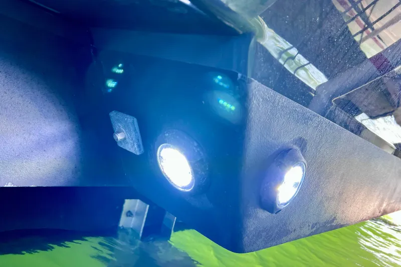 Slide: The Image of Underwater lights on 2024 NX Boats 370 HT, illuminating vibrant green water. - 91