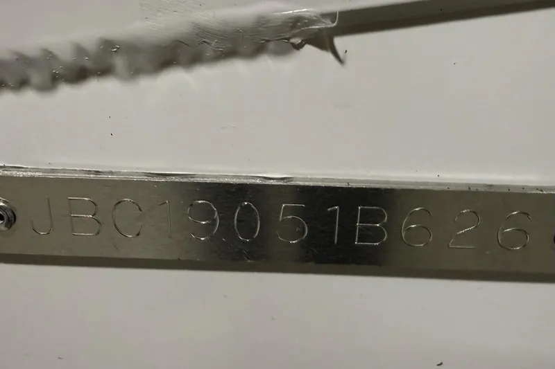 Slide: The Image of Metallic serial number plate on Express H22 Bay, 2026 model. - 17