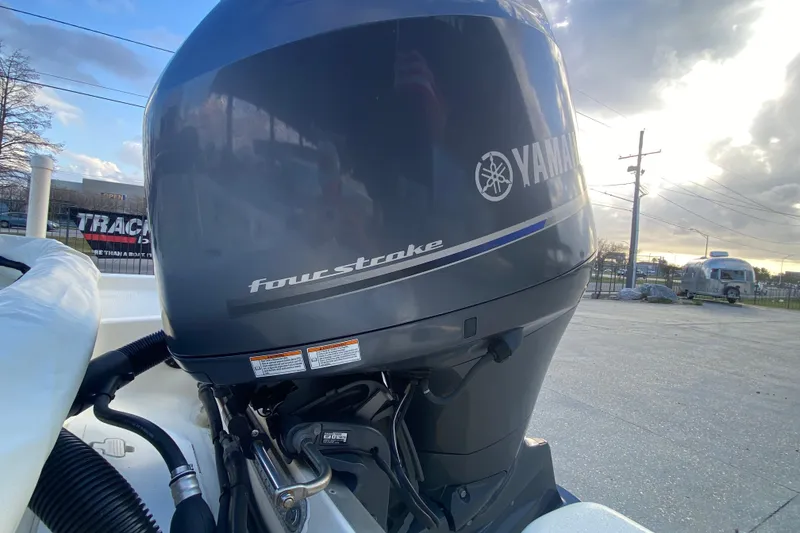 Slide: The Image of Yamaha four-stroke engine on 2018 NauticStar 215 XTS boat, outdoor setting. - 19