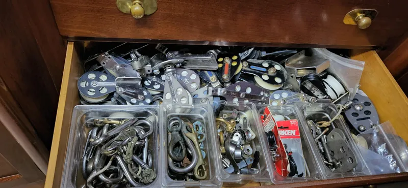 Slide: The Image of Drawer filled with assorted sailing hardware from a 1983 Thackwray Custom Pilothouse Motorsailer. - 22
