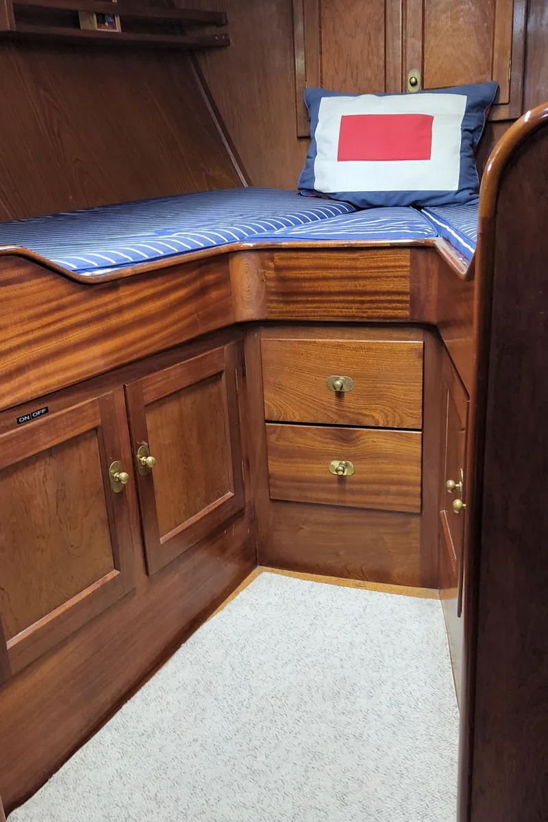 Slide: The Image of Cozy wooden cabin interior of 1983 Thackwray Custom Pilothouse Motorsailer with bed and storage. - 23