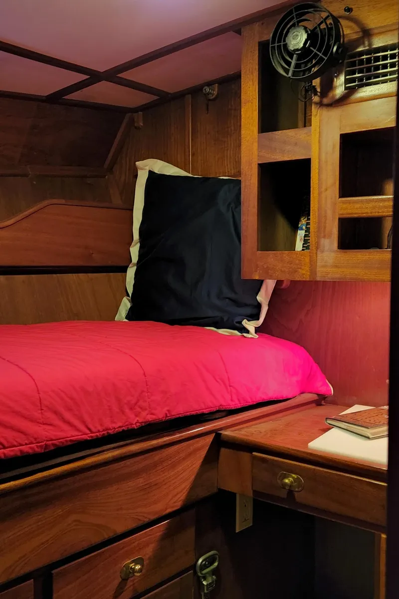 Slide: The Image of Cozy cabin interior of 1983 Thackwray Custom Pilothouse Motorsailer with wooden furnishings. - 29