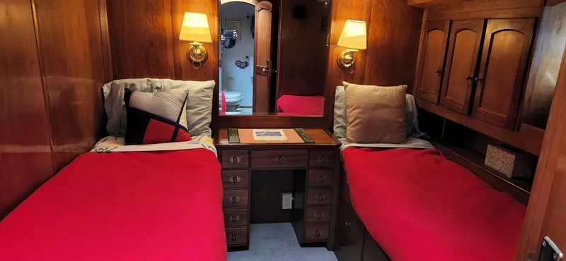 Slide: The Image of Twin beds in a cozy cabin of a 1983 Thackwray Custom Pilothouse Motorsailer. - 33