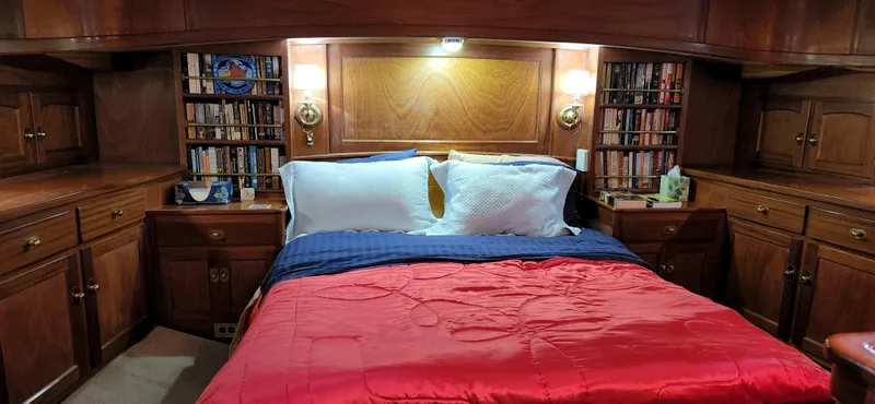 Slide: The Image of Luxurious cabin interior of 1983 Thackwray Custom Pilothouse Motorsailer with cozy bed and wooden cabinetry. - 40