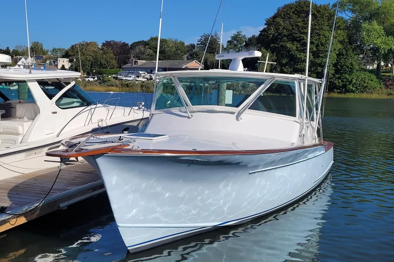 Slide: The Image of 1984 Sunny Briggs 37 Express boat docked on a sunny day. - 15