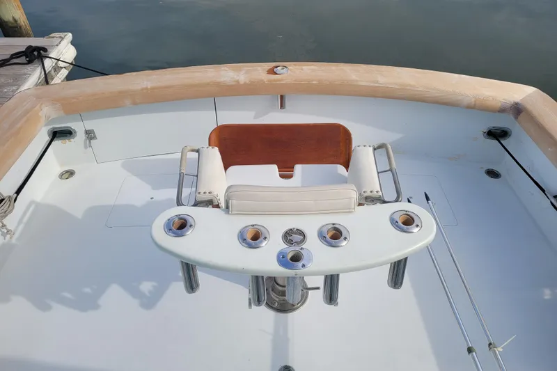 Slide: The Image of Cockpit of 1984 Sunny Briggs 37 Express boat with fishing chair and rod holders. - 3