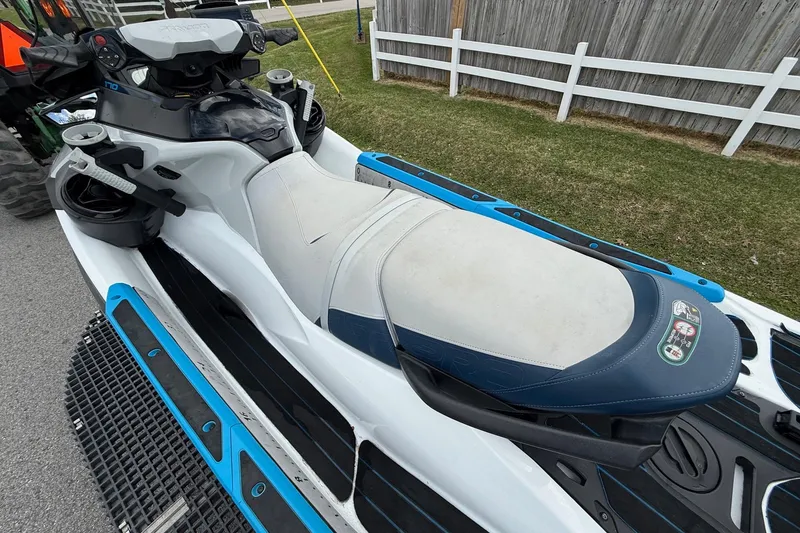 Slide: The Image of 2022 Sea-Doo FishPro Sport 170 jet ski with white and blue seating, parked outdoors. - 8
