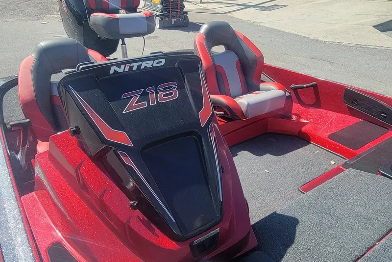 Slide: The Image of 2026 Nitro Z18 boat interior with red and gray seating, showcasing sleek design. - 12