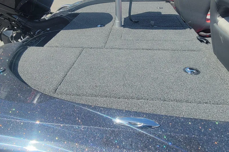 Slide: The Image of 2026 Nitro Z18 boat deck with carpeted surface and metallic finish. - 16