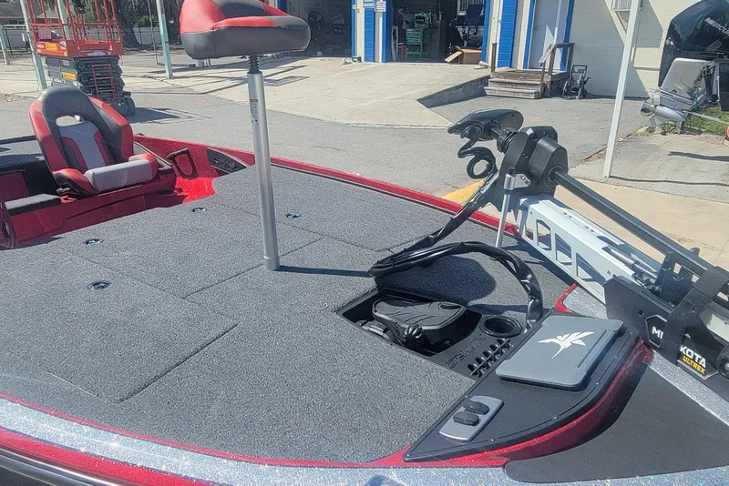 Slide: The Image of 2026 Nitro Z18 boat deck with seating and trolling motor in a sunny outdoor setting. - 9