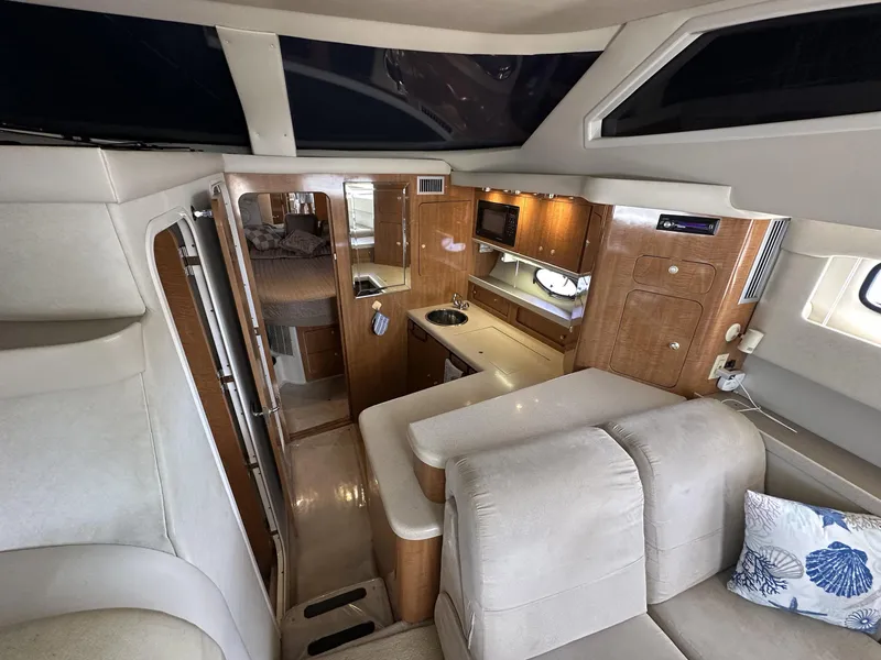Slide: The Image of Luxurious interior of a 2002 Regal 3880 yacht with modern amenities and cozy seating. - 17