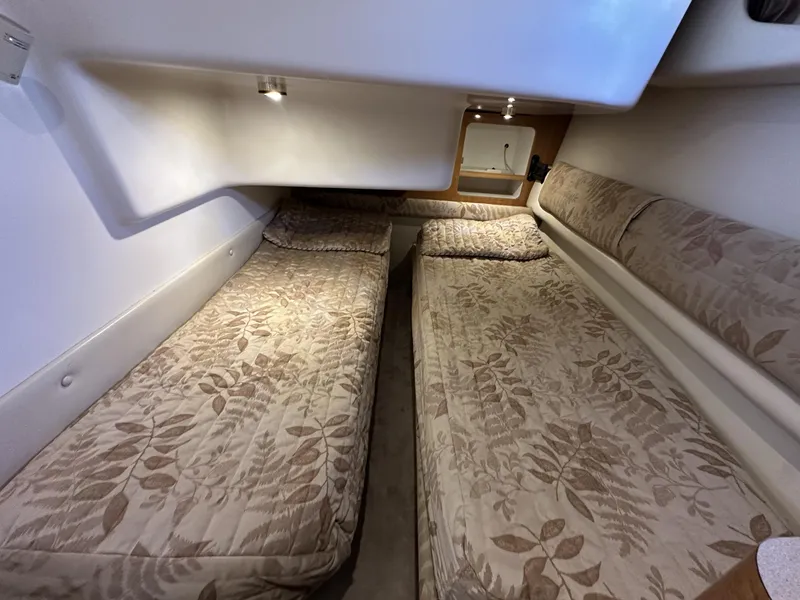 Slide: The Image of Interior cabin of 2002 Regal 3880 yacht with twin beds and floral bedding. - 23