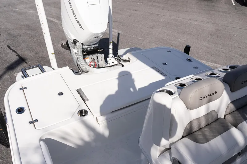Slide: The Image of 2026 Caymas 26 HB boat with Mercury engine, featuring spacious seating and storage. - 7